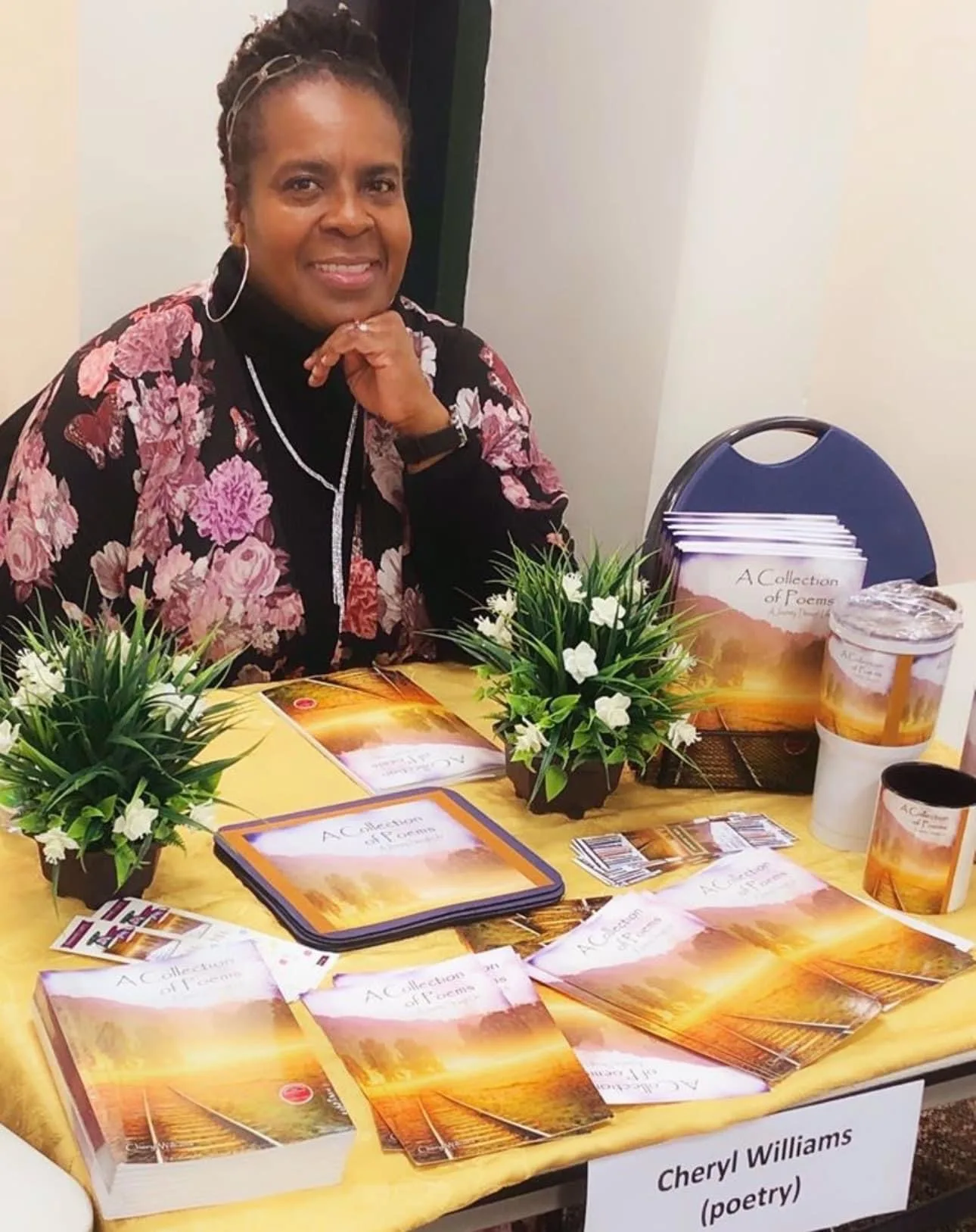 Signing copies of A Collection of Poems at an early author event.